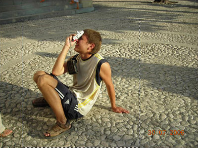 Select the boy with a camera